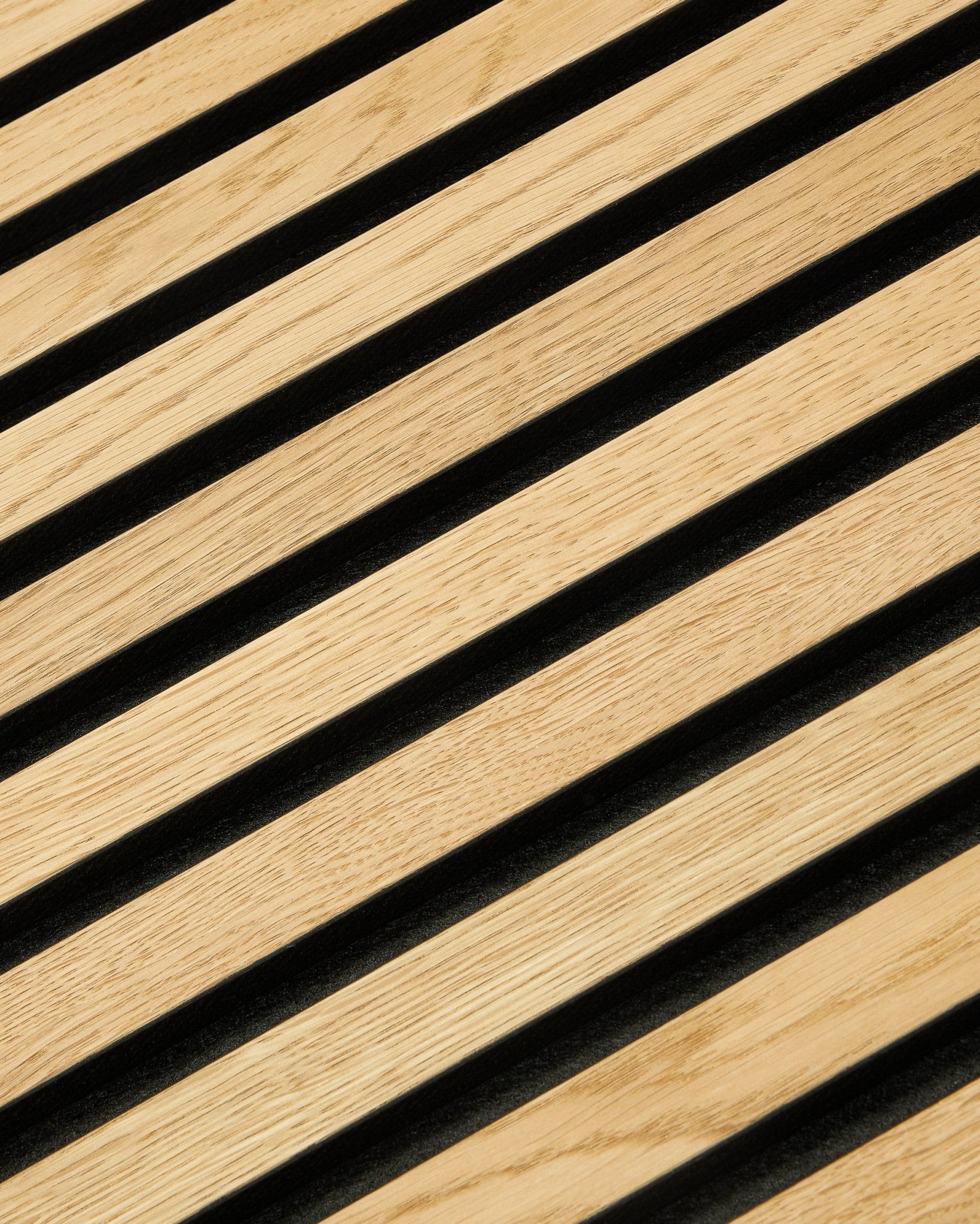 Close-up of WoodUpp Akupixel Rustic Natural Oak acoustic panel, 60x60 cm, featuring a modern Nordic geometric pattern with diagonal lines and black gaps.