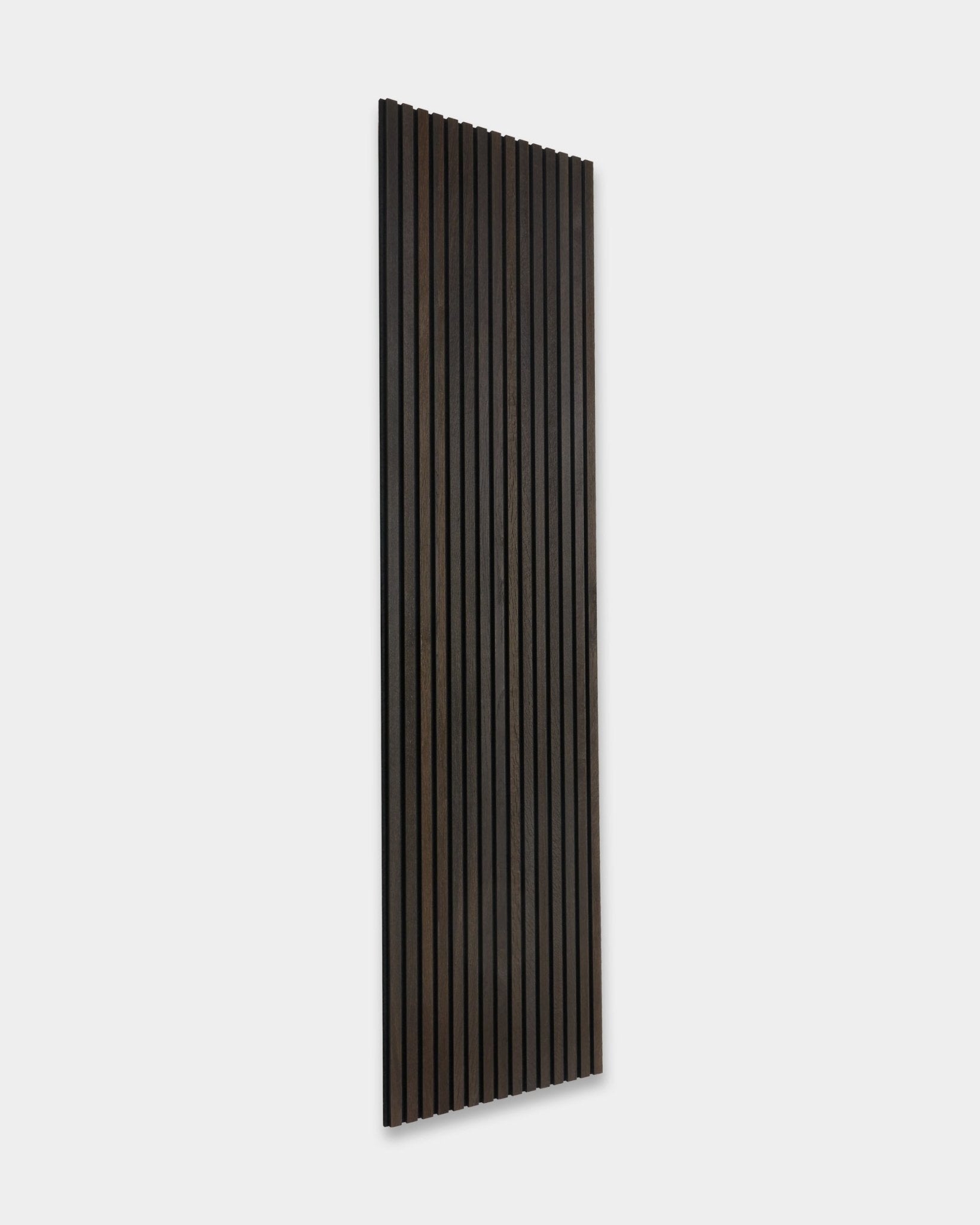 WoodUpp Akupanel acoustic panel in Smoked Oak, 300x60 cm, features vertical wood slats and minimalist Scandinavian design on a light background.