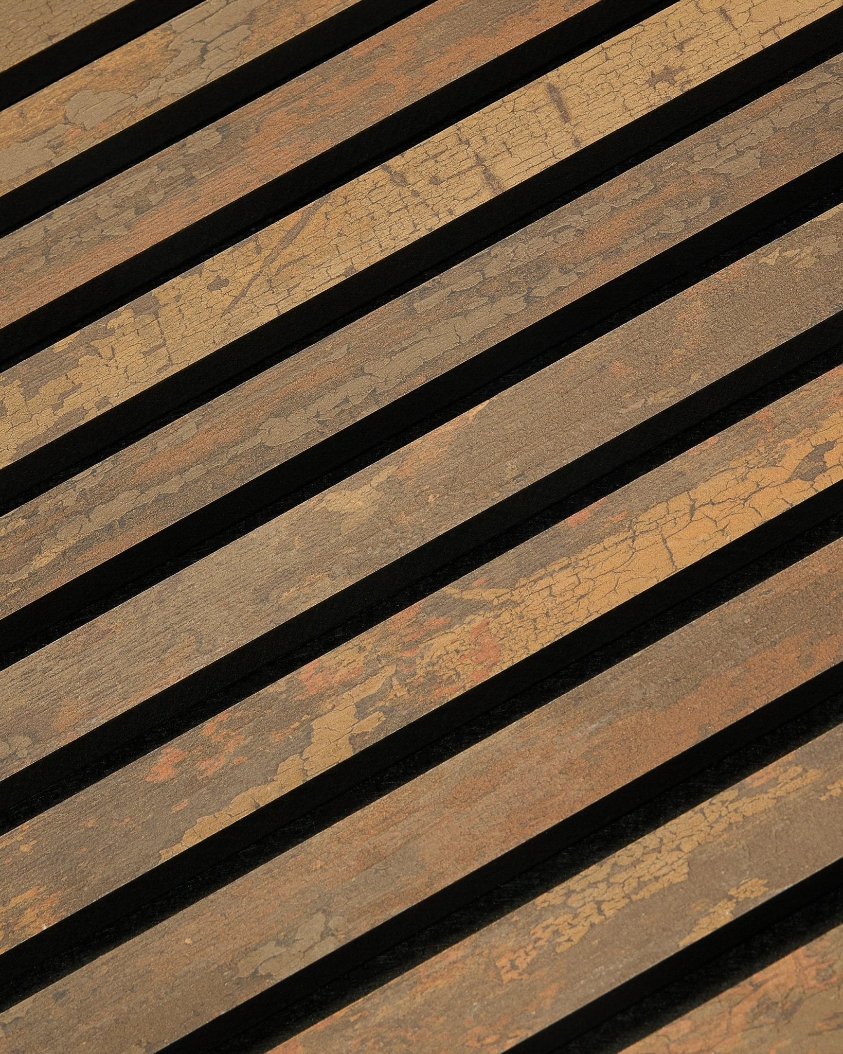 Close-up of WoodUpp Rebel Akupanel in Oxide Copper, 240x60cm, showing linear slatted acoustic panel design with narrow gaps for enhanced sound absorption.