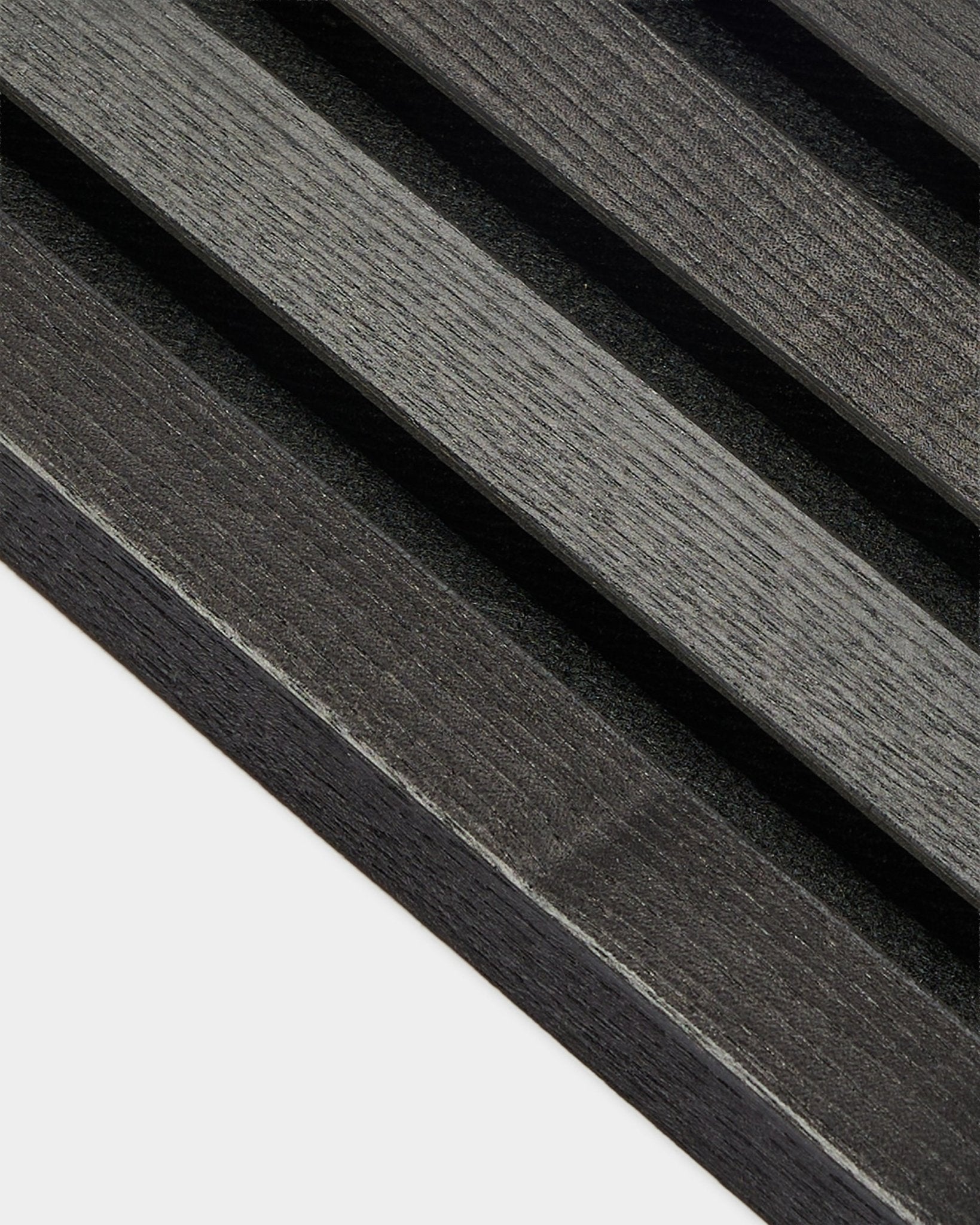 Close-up of WoodUpp End Lamella in Black Ash finish, 2.2 cm thick, designed for Akupanel acoustic panel installations or use with an MDF frame.