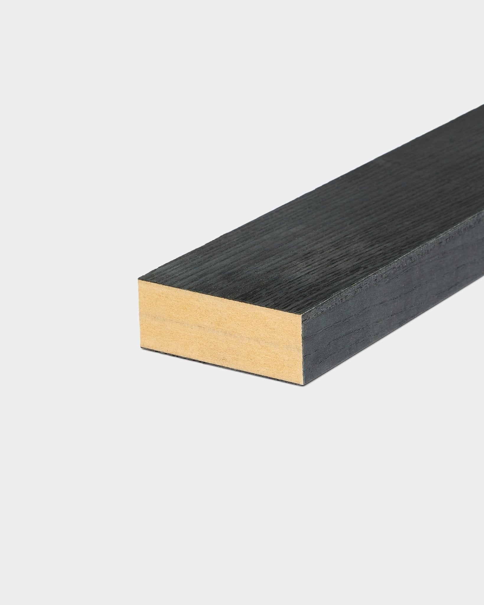 End lamella in Black Ash (6.7 cm) featuring a black-painted surface and natural wood edge, designed for use with WoodUpp Akupanel acoustic panels.