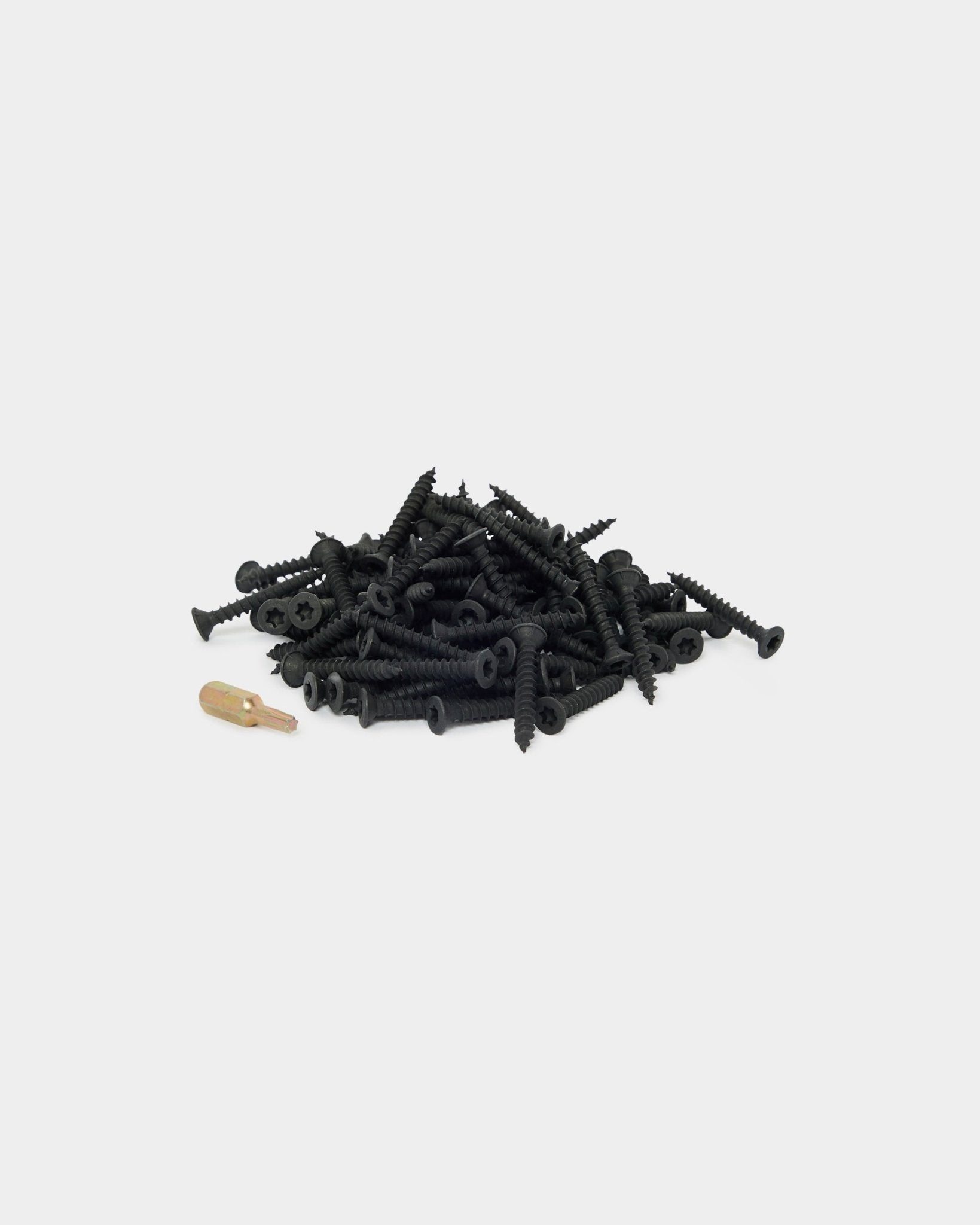 WoodUpp installation kit with 100 black screws and yellow wall plug, designed for Akupanel acoustic wood panel projects. Shown on a white background.