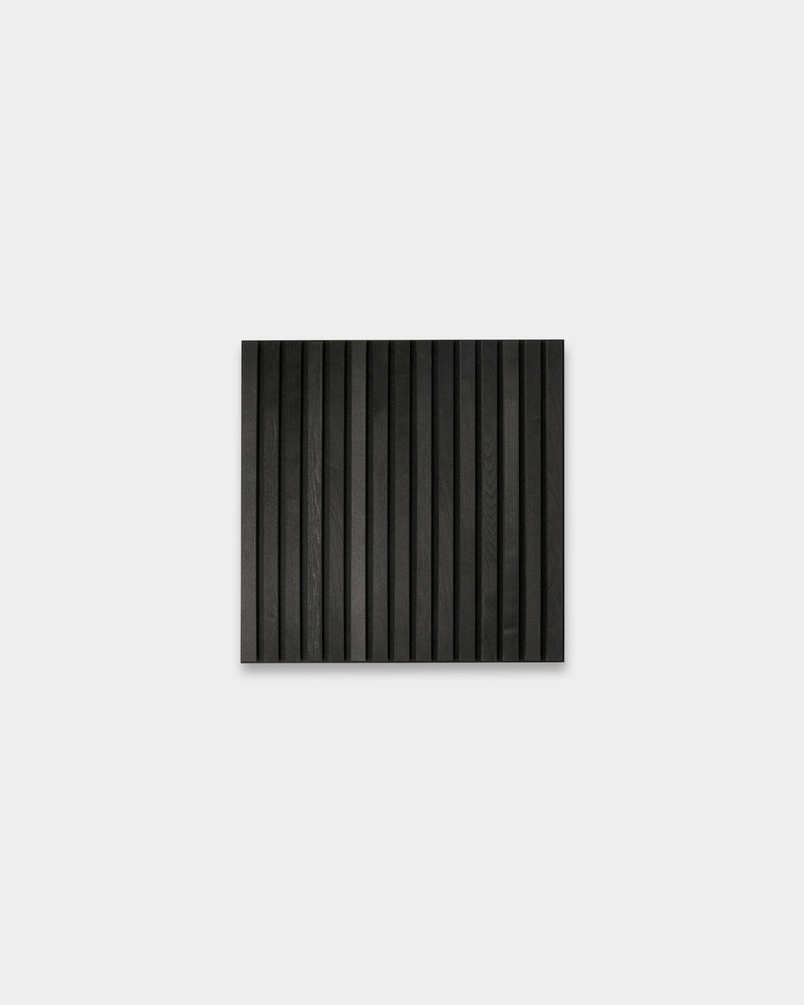 WoodUpp Akupixel Black Ash acoustic panel, 60x60 cm, with vertical grooves for minimalist Nordic interiors; part of the Tonal collection.