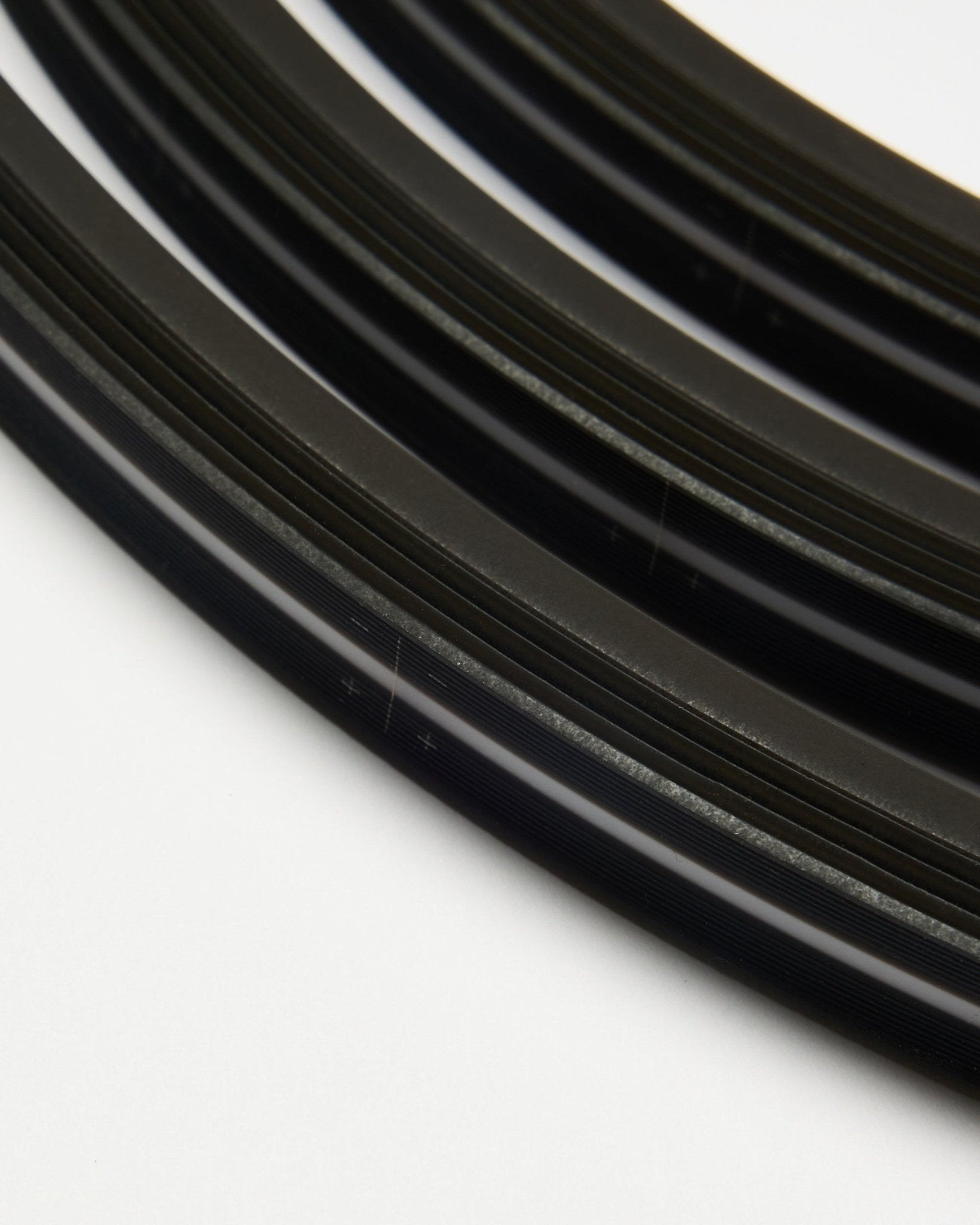 Detail of Lumi LED striplight in black, 240 cm, set of 4 by WoodUpp, designed for integration with Akupanel acoustic panels or other LED installations.