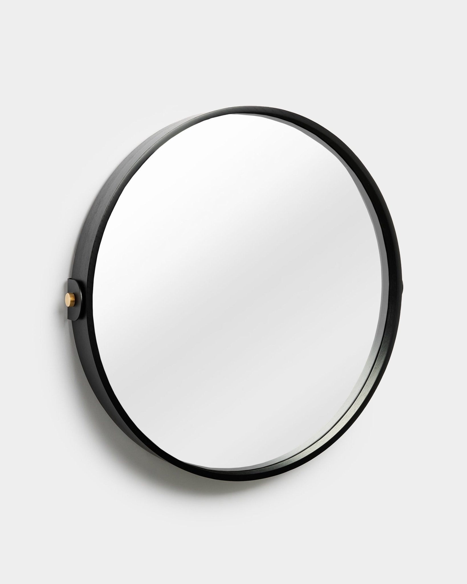 WoodUpp Linn Mirror in Black Oak, featuring a round adjustable frame with side knob, shown against a plain light gray background.