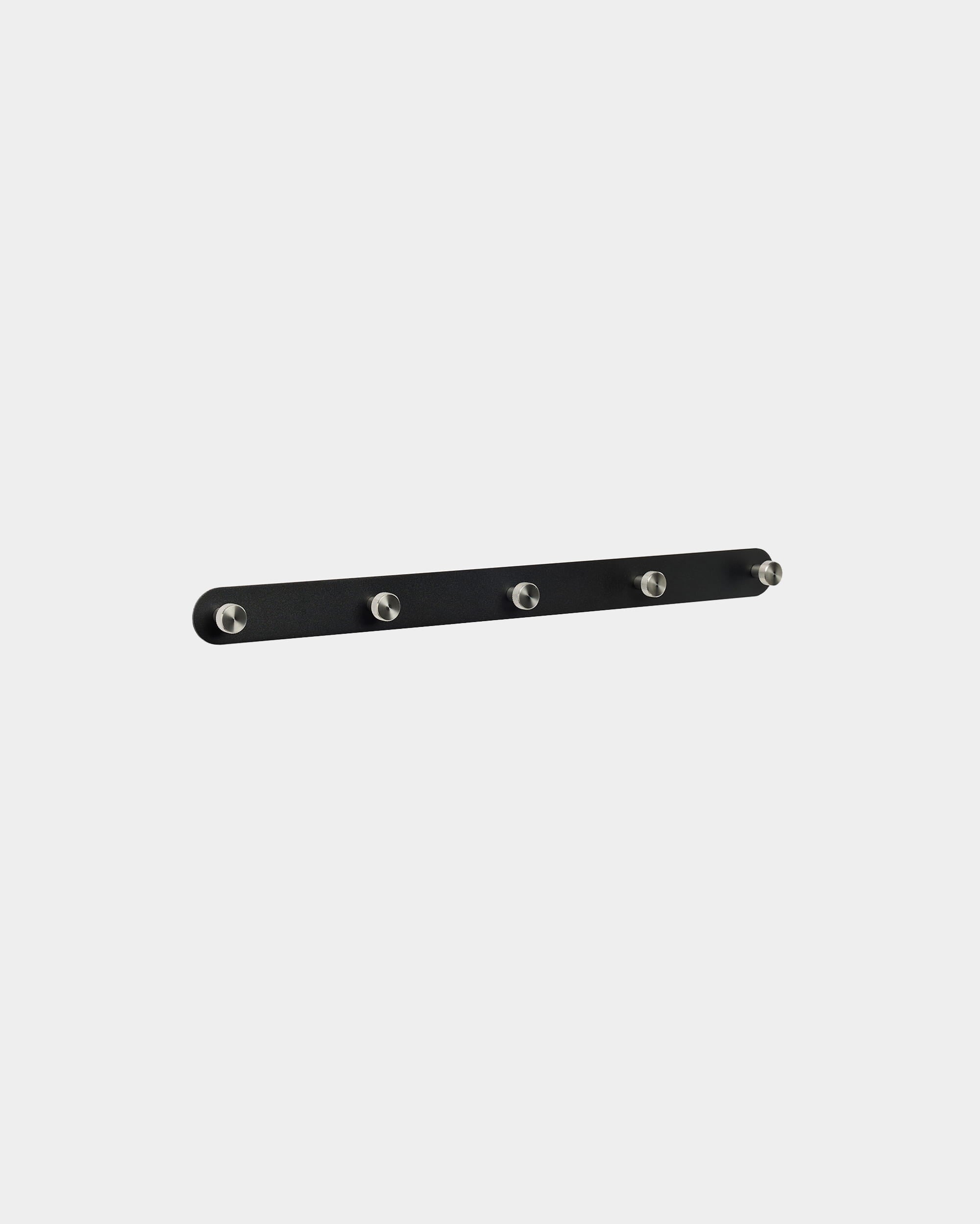 WoodUpp Norr Coat Hook Rack X5 in black and stainless steel, with five evenly spaced hooks, mounted on a plain white background. Nordic minimalist design.