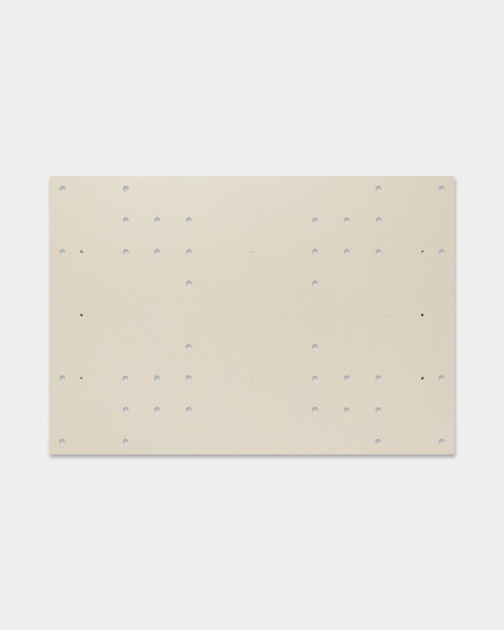 The Nell | TV-Mount / BM1 by WoodUpp is a 64x44 cm beige board for acoustic panels, featuring grid holes and cross marks for flexible mounting options.