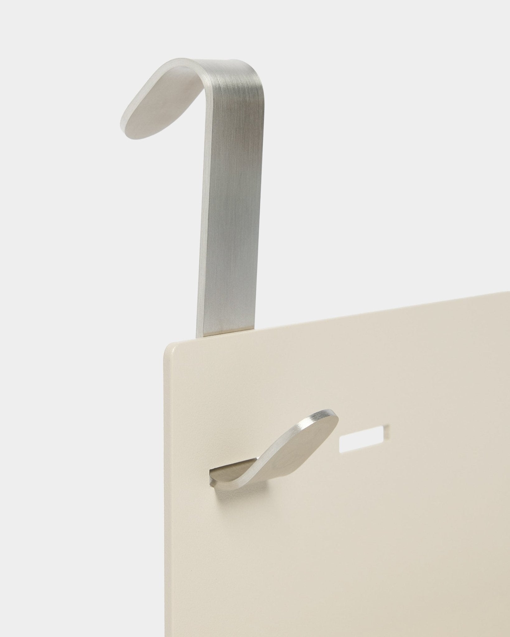 The Nell Metal Shelf/BM1 by WoodUpp in beige (63x13.4cm) includes a silver metal hook and an extra small hook, designed for use with adjustable acoustic panels.